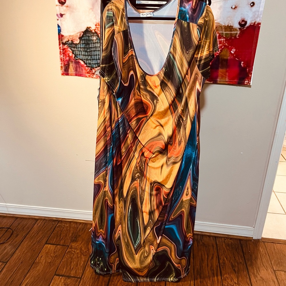 Label reads “Beyond this plane” beautiful long dress